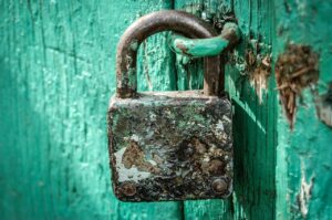 Rusty Padlock On Blue Door ALT